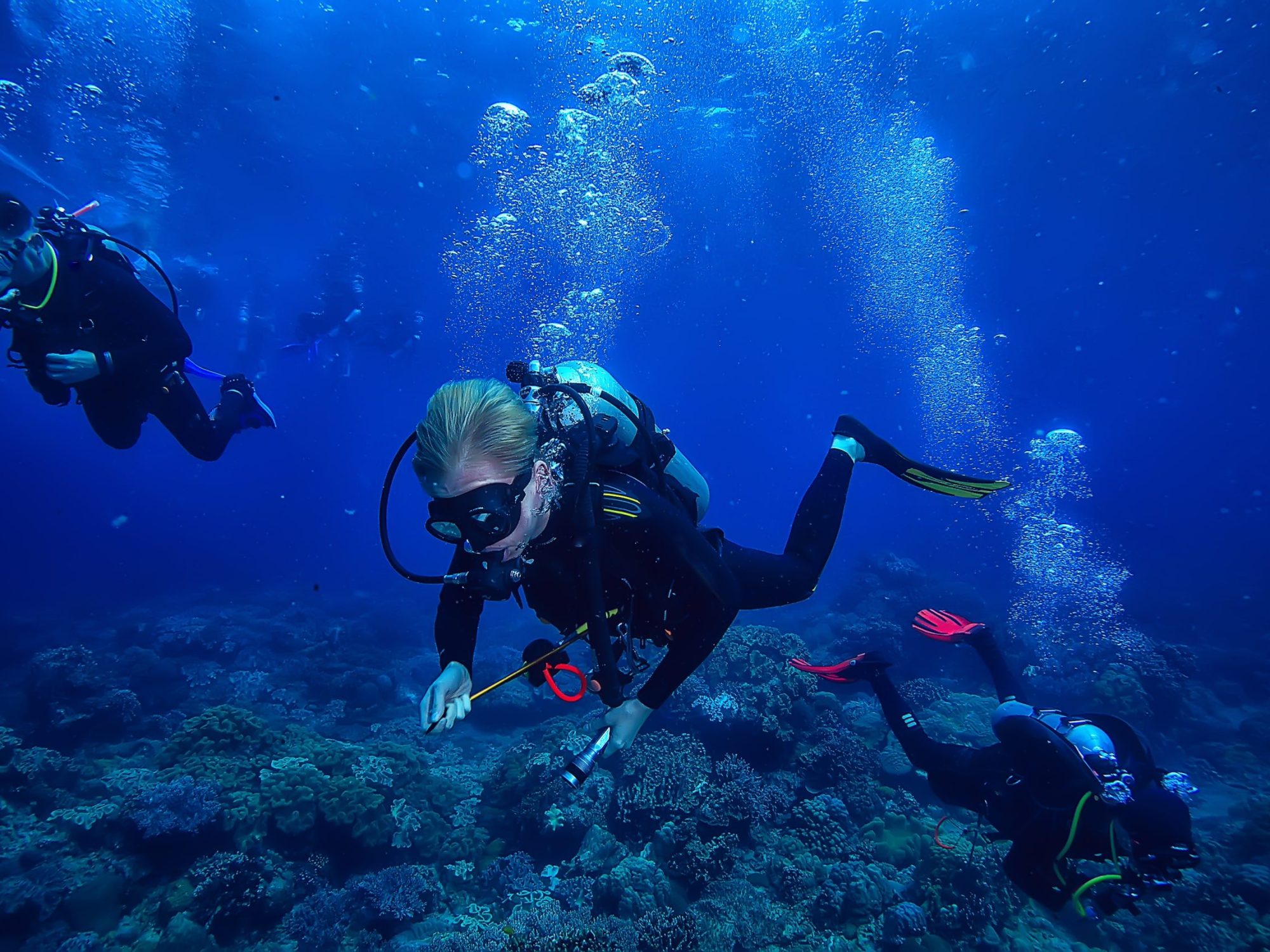 diver breathes air under water bubbles, releases gas, landscape underwater depth